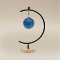 Load image into Gallery viewer, (agate blue)
Agate blue ceramic paw ball ornament made with ashes, handcrafted by Ahava Memorials as a calm and loving pet memorial art piece.