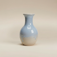 Load image into Gallery viewer, (ice)
Handcrafted ice-blue ceramic bud vase made with ashes, a peaceful memorial keepsake by Ahava Memorials.