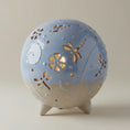 Load image into Gallery viewer, (ice)
Handcrafted ice-blue ceramic cremation memorial light made with ashes, symbolizing peace and clarity.
