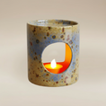 Load image into Gallery viewer, (jasper gold)
Jasper gold ceramic candle holder made with ashes, radiating light and comfort as a handcrafted memorial keepsake.
