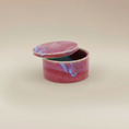 Load image into Gallery viewer, (sunstone-red)
Ahava Memorials sunstone red round ceramic box urn made with ashes, shown open as a heartfelt handcrafted memorial keepsake.