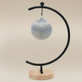 Load image into Gallery viewer, (ice)
Handcrafted ice-blue ceramic ball ornament made with ashes, a peaceful cremation keepsake by Ahava Memorials.
