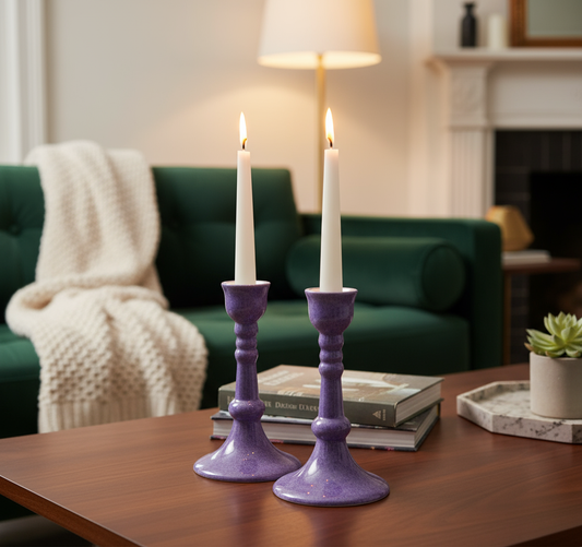 Pair of handcrafted ceramic candlesticks by Ahava Memorials, made with ashes and illuminated by soft light as a modern remembrance display.