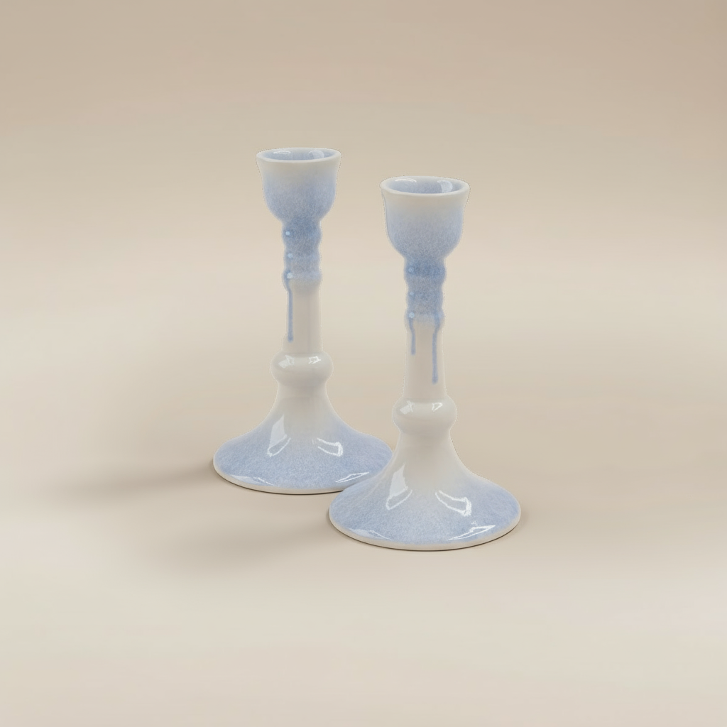 (ice)
Handcrafted ice-blue ceramic candlesticks made with ashes, peaceful cremation memorials by Ahava Memorials.