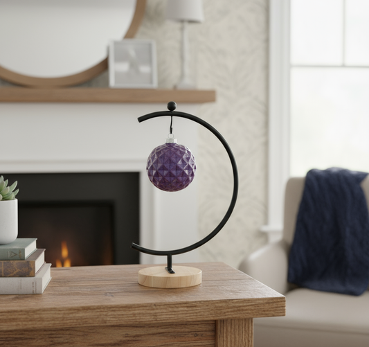 Ahava Memorials handcrafted ceramic facet ornament made with ashes, displayed on a living room table with candles and flowers as a modern cremation keepsake.