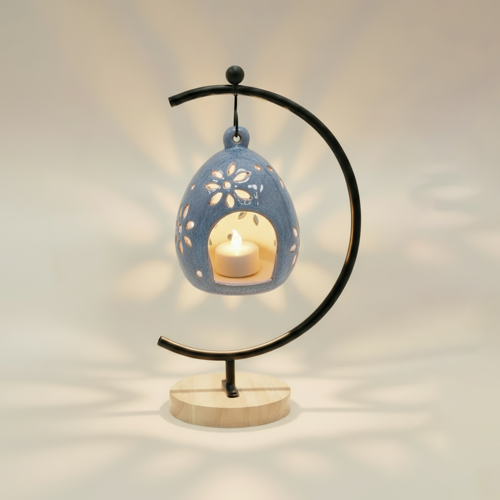 (ice)
Handcrafted ice-blue ceramic floral luminary made with ashes, featuring delicate cutout petals that glow from a candle inside on its stand by Ahava Memorials.