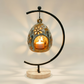 (jasper gold)
Jasper gold ceramic floral luminary made with ashes, a luminous handcrafted cremation memorial by Ahava Memorials with a candle glowing through floral openings.