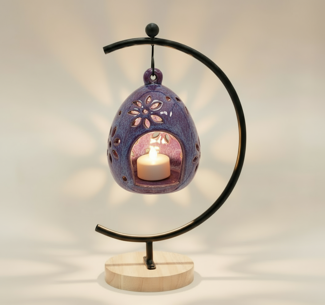 (lavender)
Purple decorative lantern with a candle inside on a white background