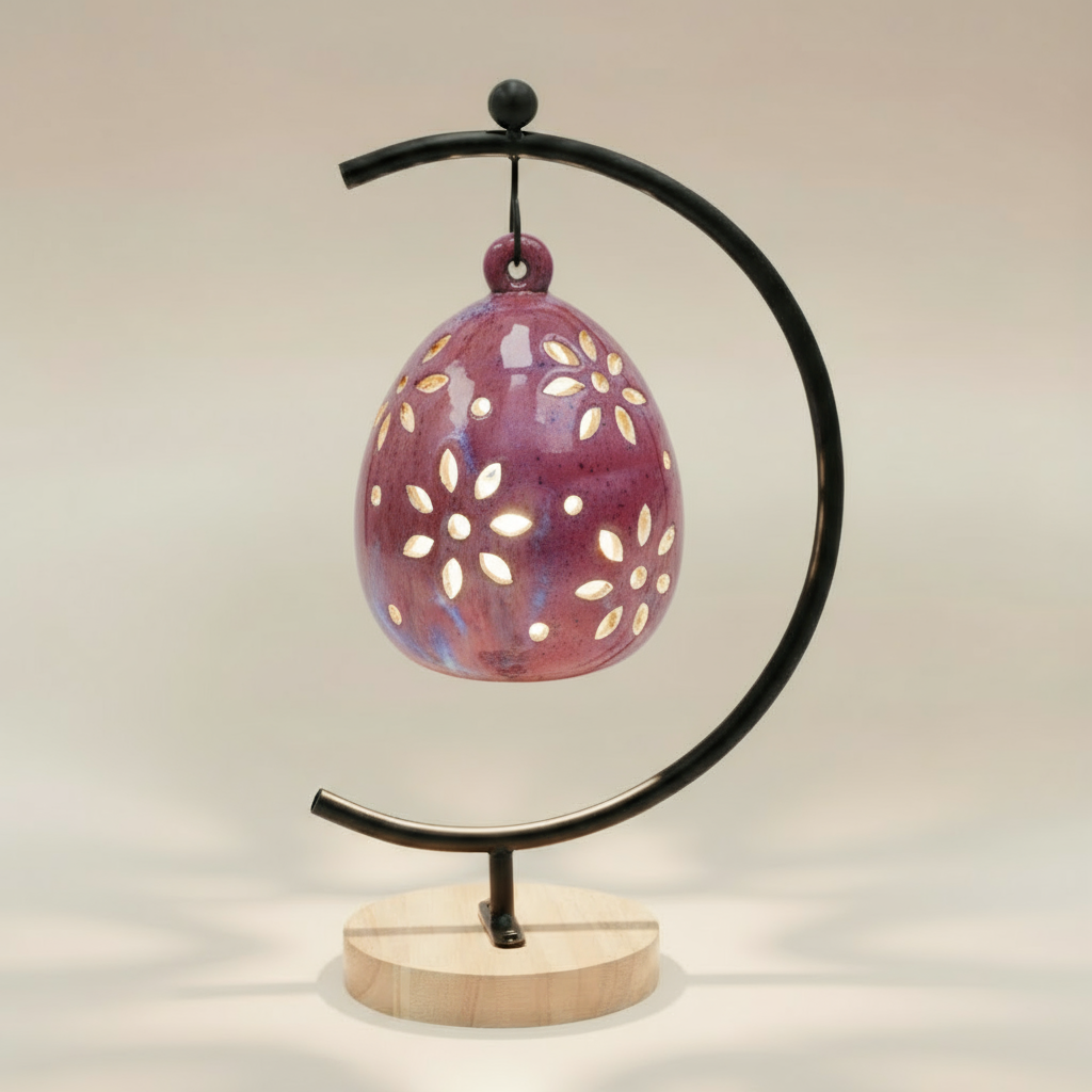 (sunstone red)
Back view of the sunstone red floral luminary by Ahava Memorials, handcrafted with ashes and displayed with its candle and ceramic stand as a radiant memorial piece.