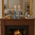 Load image into Gallery viewer, Ceramic candlesticks by Ahava Memorials, handcrafted with ashes and displayed on a home mantel beside framed memories as elegant cremation memorial art.
