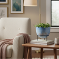 Load image into Gallery viewer, Ceramic modern planter with stand by Ahava Memorials, handcrafted with ashes and filled with a lush plant, shown in bright natural light as a living memorial piece.
