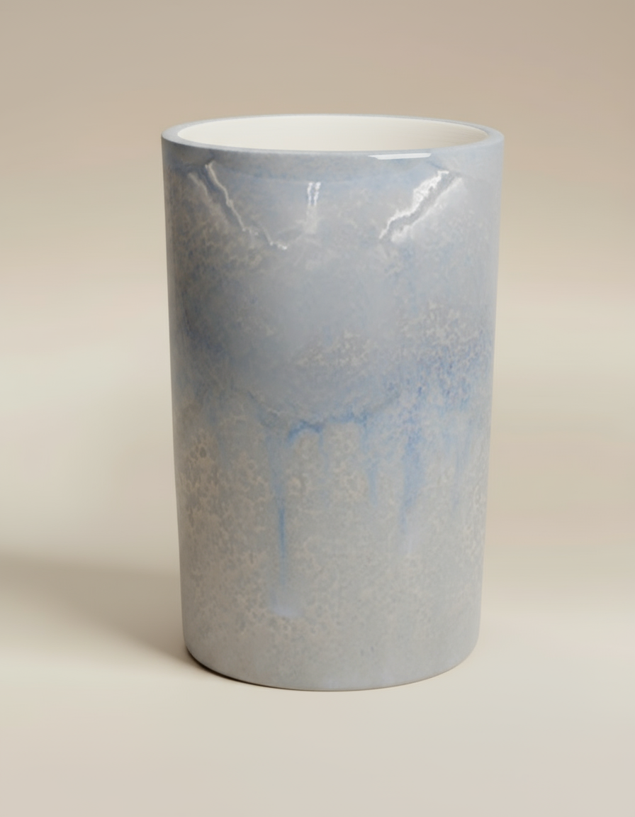 (ice)
Handcrafted ice-blue large cylinder ceramic vase made with ashes, a peaceful cremation memorial by Ahava Memorials.