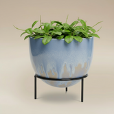 (ice)
Handcrafted ice-blue ceramic modern planter with stand made with ashes, a peaceful cremation memorial by Ahava Memorials.