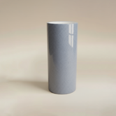 (ice)
Handcrafted ice-blue narrow cylinder ceramic vase made with ashes, a serene cremation memorial by Ahava Memorials.