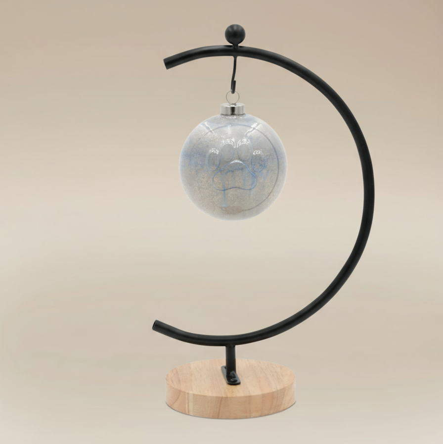 (ice)
Handcrafted ice-blue ceramic paw ball ornament made with pet ashes, a peaceful cremation keepsake by Ahava Memorials.