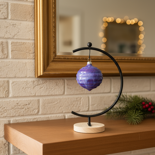 Ahava Memorials handcrafted ceramic wave ornament made with ashes, displayed in a softly lit living room as a serene cremation keepsake symbolizing peace and memory.

