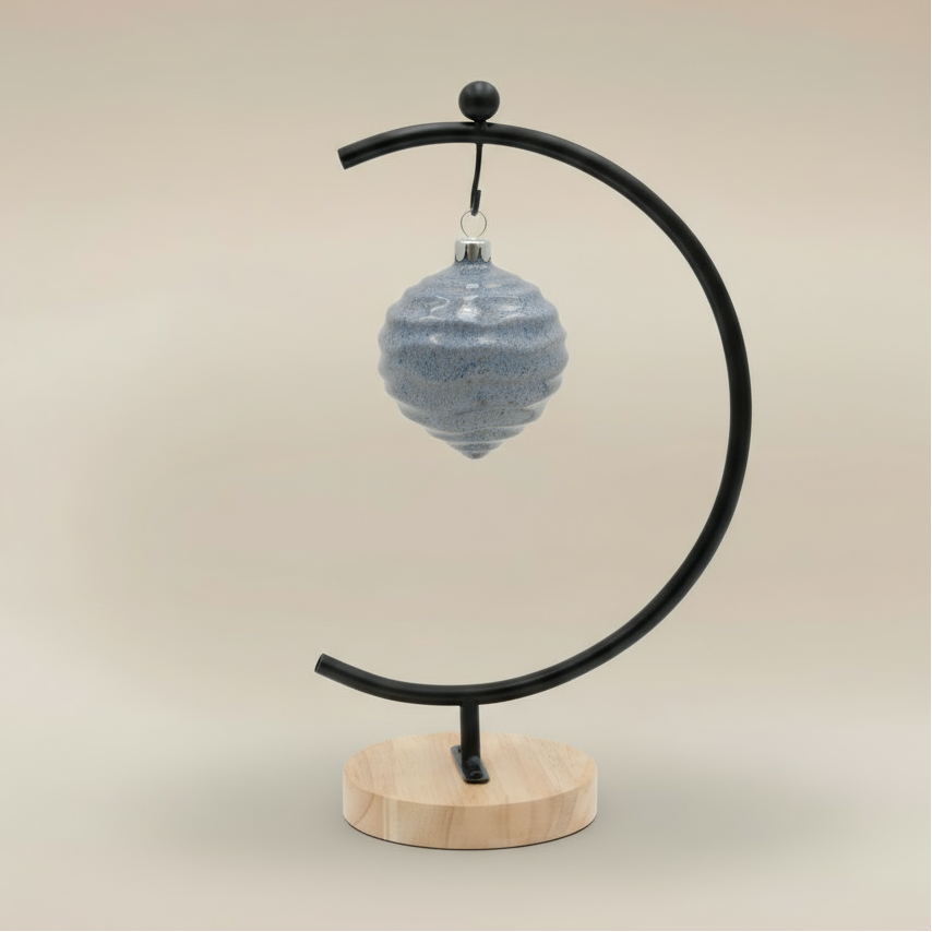 (ice)
Handcrafted ice-blue ceramic wave ornament made with ashes, a peaceful cremation keepsake by Ahava Memorials.