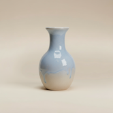 (ice)
Handcrafted ice-blue ceramic bud vase made with ashes, a peaceful memorial keepsake by Ahava Memorials.