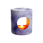 (Lavender)
Ceramic tealight holder with a circular cutout showing a lit candle inside on a white background