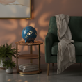 Load image into Gallery viewer, Dragonfly Luminary Light by Ahava Memorials. Decorative blue spherical lamp on a wooden side table in a living room setting.
