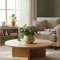 Load image into Gallery viewer, Ahava Memorials handcrafted ceramic tulip vase made with ashes, displayed in a peaceful home interior with soft natural light and fresh flowers as a heartfelt cremation memorial.

