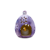 (lavender)
Purple decorative lantern with a candle inside on a white background