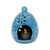 (agate blue)
A blue ceramic luminaria with a floral pattern and a candle inside, designed to be a memorial tribute.