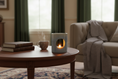 Load image into Gallery viewer, Cozy living room with a lit candle on a wooden table, books, and a blanket on a sofa.
