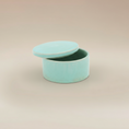 Load image into Gallery viewer, (copper)
Ahava Memorials copper round ceramic box urn made with ashes, handcrafted and displayed open to reveal its memorial interior.
