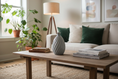 Load image into Gallery viewer, Ahava Memorials twist vase. Living room with a beige sofa, wooden coffee table, and decorative items.
