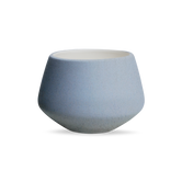 (ice)
A white ceramic tulip planter with a smooth, glazed finish.